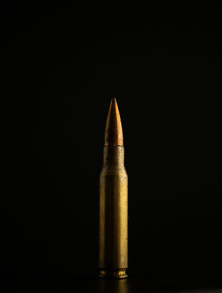Rifle bullet close up with black background