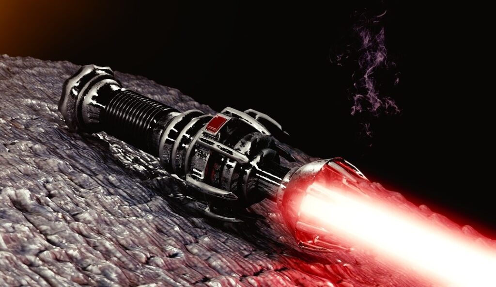 Close up on handle of red light saber sitting on stone