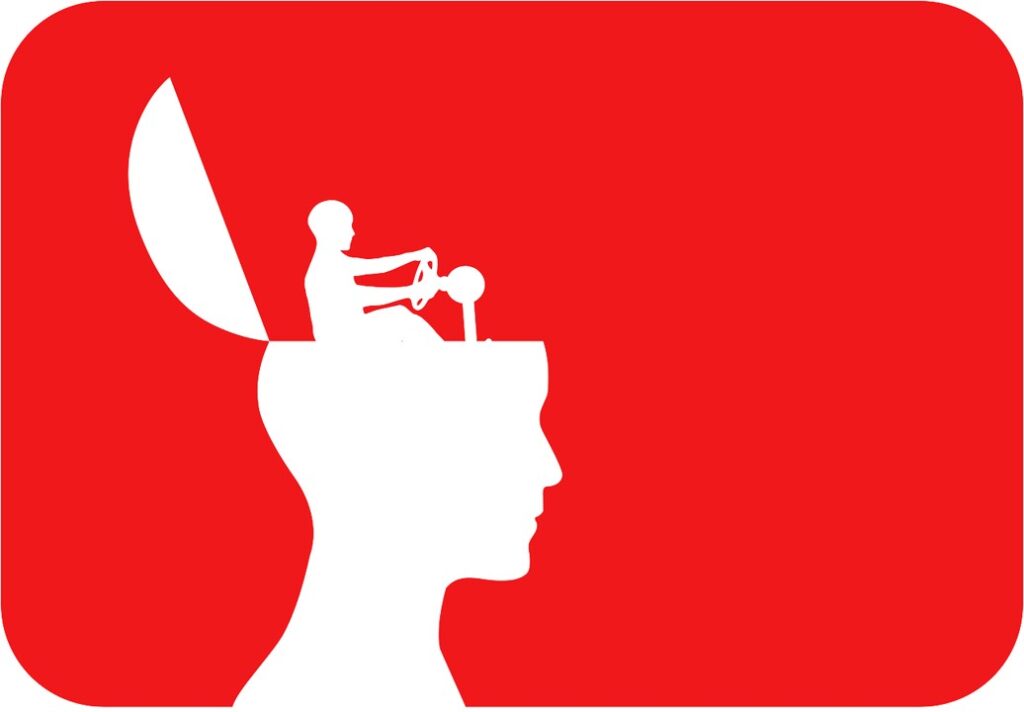 White on red silhouette of a head with flip top and inside sits a tiny person who appears to be driving.